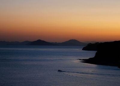 Scenic view of sea against clear sky during sunset