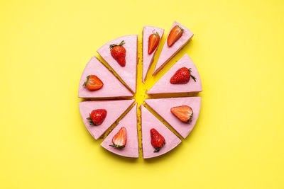 Directly above shot of fruits against yellow background