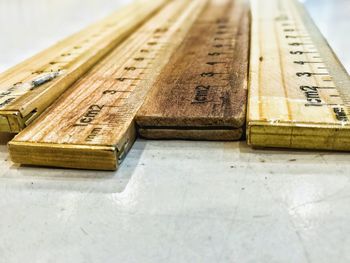 Close-up of rulers on table