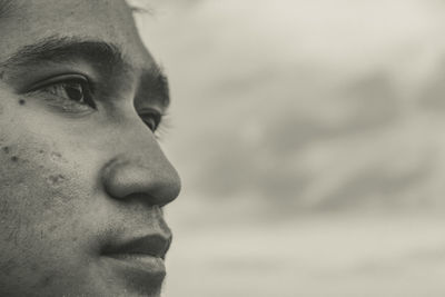 Close-up portrait of man looking away