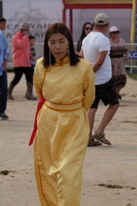 Rear view of people walking in temple