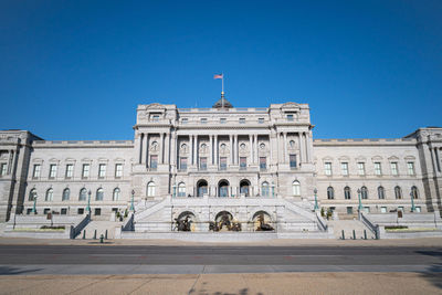 Low angle view of building against blue sky