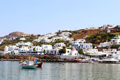 Residential buildings at mykonos island against clear sky