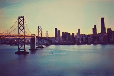 View of bridge over river against sky during sunset