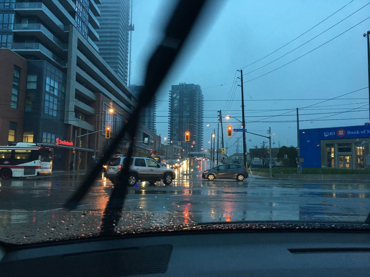 CARS ON WET STREET AT NIGHT