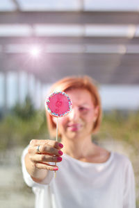 Portrait of woman holding ice cream cone