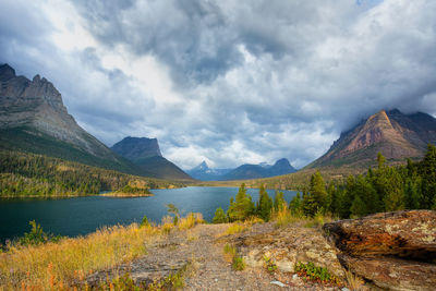 Scenic view of lake and mountains against sky