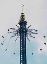 Low angle view of ferris wheel against sky