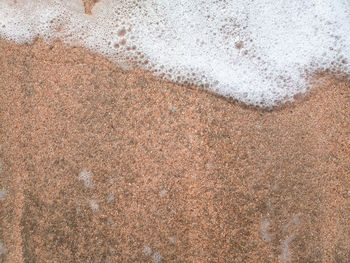 High angle view of wet sand