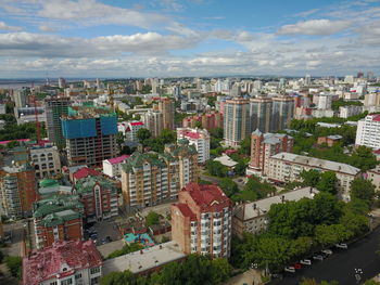 High angle view of buildings in city against sky