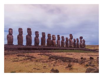 Moai statues against sky at easter island