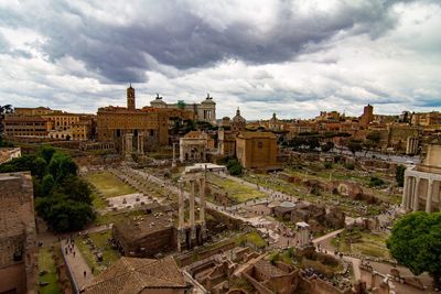 High angle view of roman ruins against cloudy sky