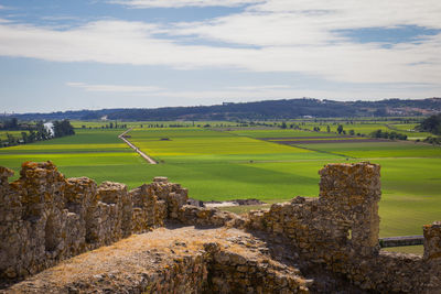 Scenic view of farm against sky