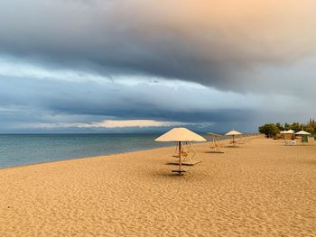 Scenic view of beach against sky during sunset