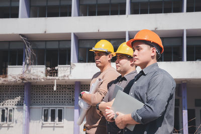 Portrait of young man working at construction site