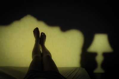 Low section of woman standing on tiled floor