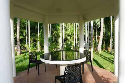 Chairs and tables in glass window at home