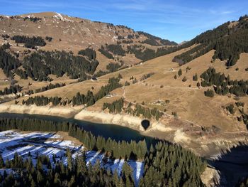 Scenic view of landscape and mountains against sky