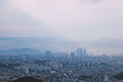 High angle view of city buildings against sky