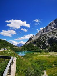 Scenic view of lake and mountains against sky