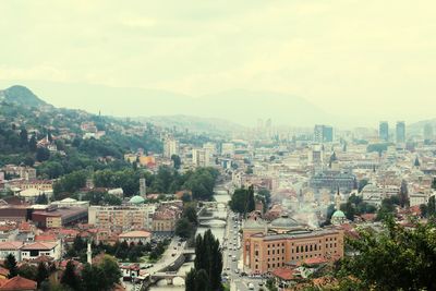 Cityscape with mountain range in background