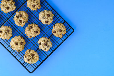 High angle view of cookies against blue background