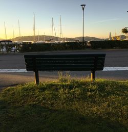 Empty park against sky during sunset