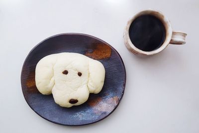High angle view of coffee cup on table