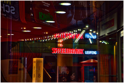 Information sign in illuminated city at night