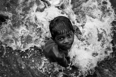 High angle portrait of young man in swimming pool