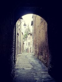 Narrow alley along buildings