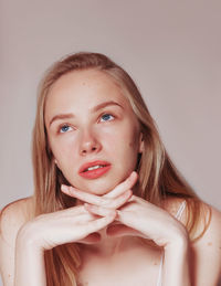 Blonde woman natural hair beauty closeup portrait