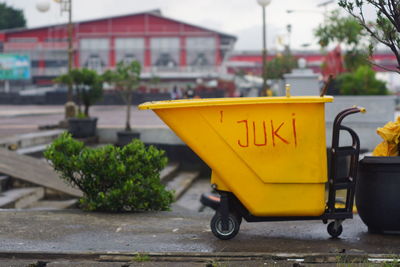 Yellow text on street in city