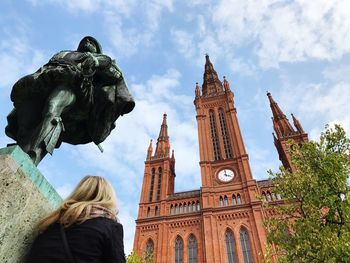 Low angle view of statue against sky