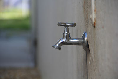 Close-up of faucet on wall