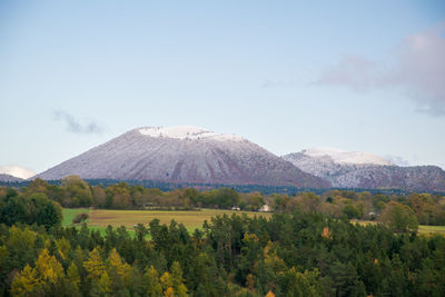 View of volcanic landscape against cloudy sky