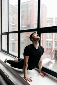 A man engaged in yoga and meditation, performing asanas