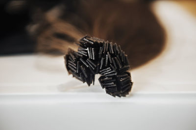 Close-up of chocolate on table against white background