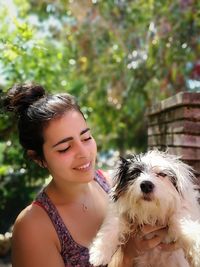 Portrait of a young woman with dog