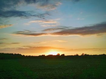 Scenic view of landscape at sunset