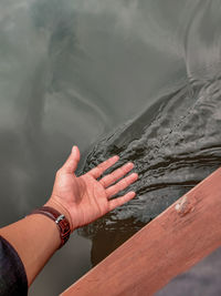 Cropped image of hand holding water
