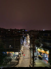 High angle view of illuminated buildings at night