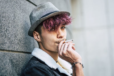 Portrait of man smoking cigarette