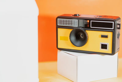 Close-up of camera against white background