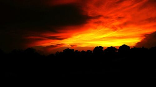 Silhouette of landscape against dramatic sky