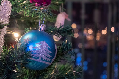 Close-up of illuminated christmas tree at night