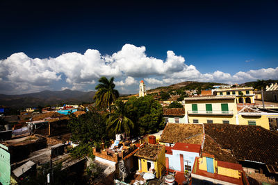 Buildings in town against sky