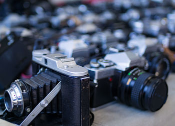 Close-up of cameras on table