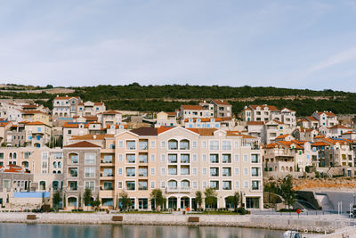 Buildings in town against sky