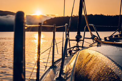 Boat in sea during sunset